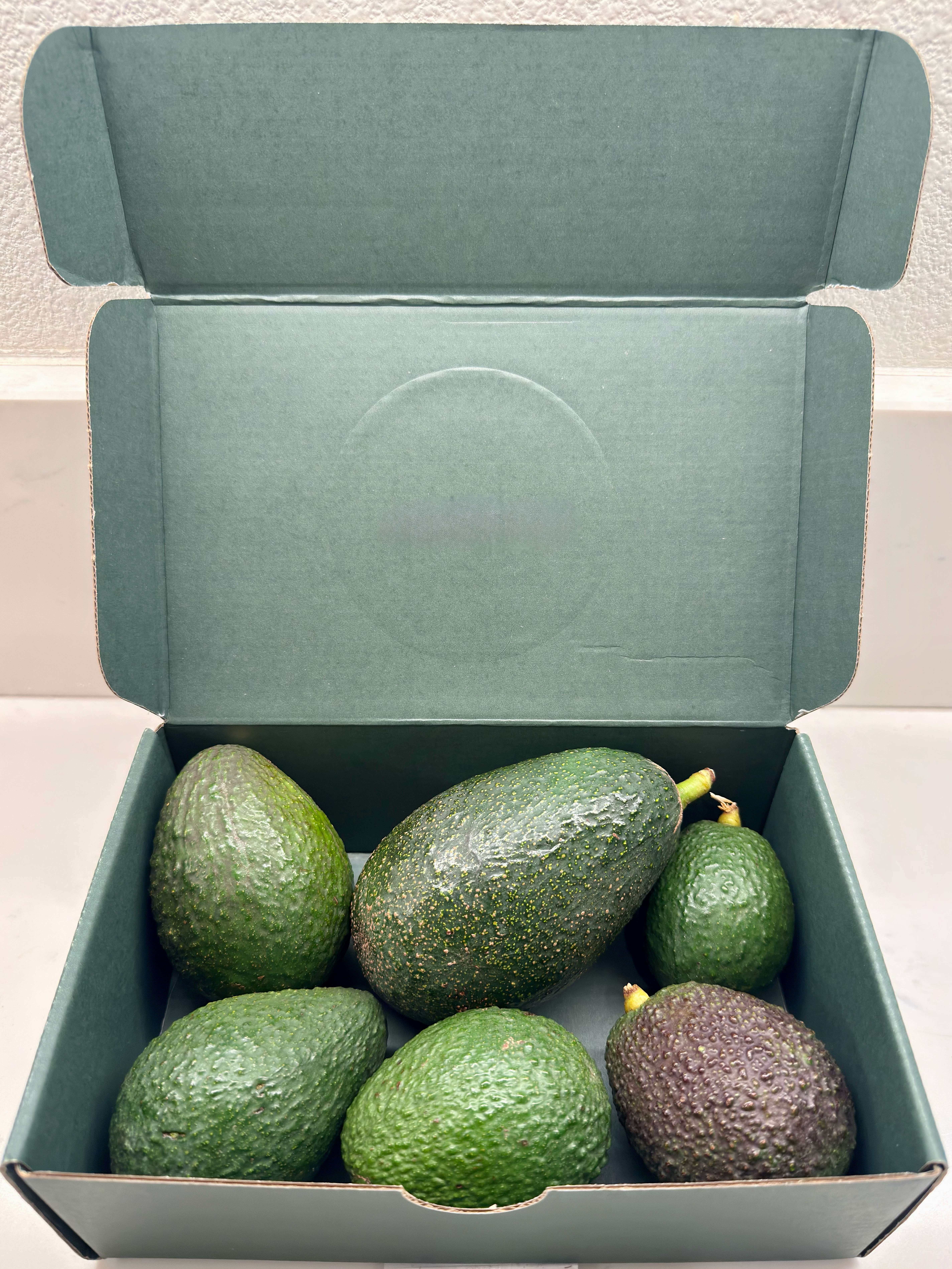 Box full of Premium Hass avocados grown at Patel Ranch in De Luz, California